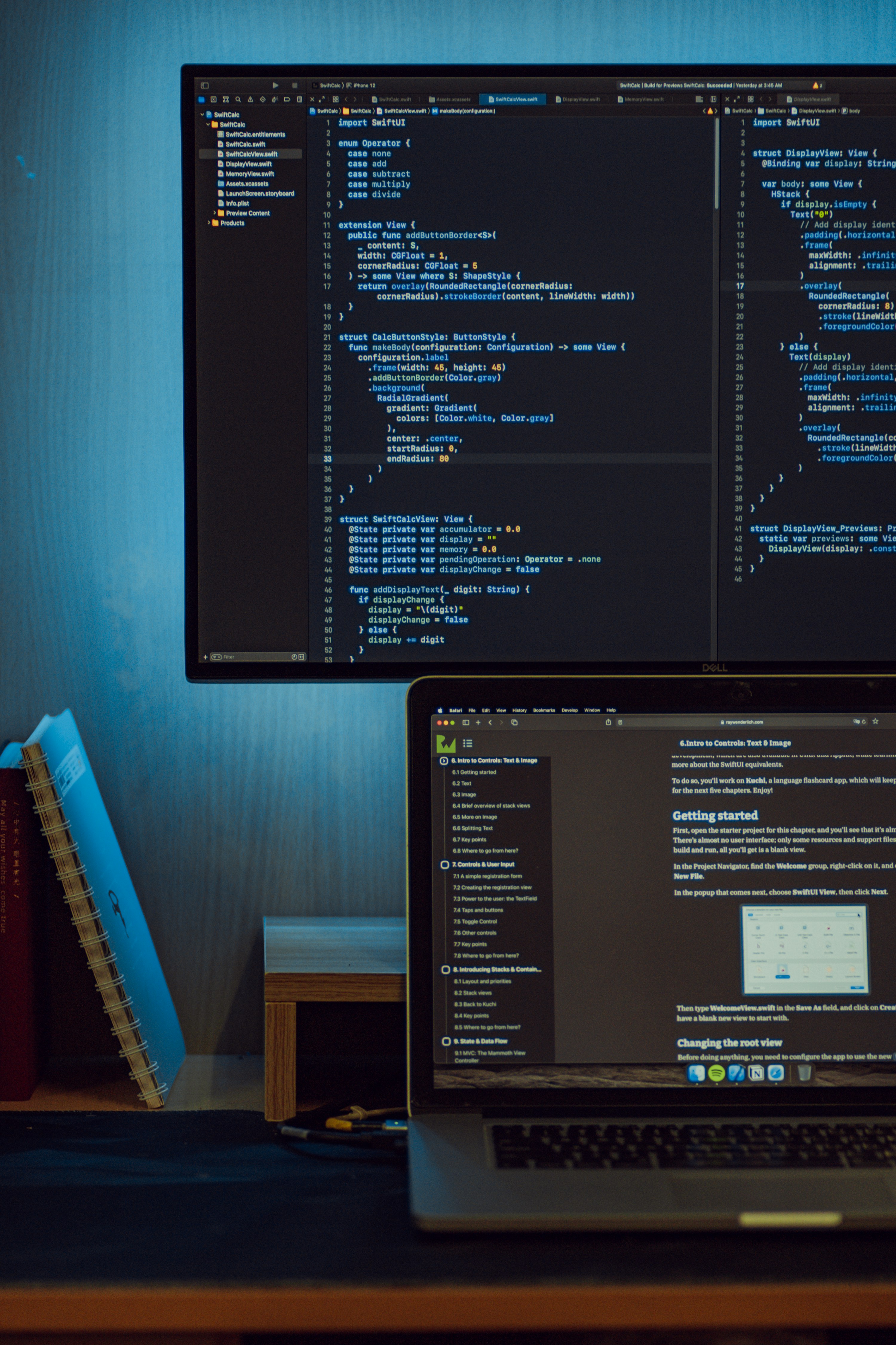 Code editor displayed on a large monitor in a technical workspace